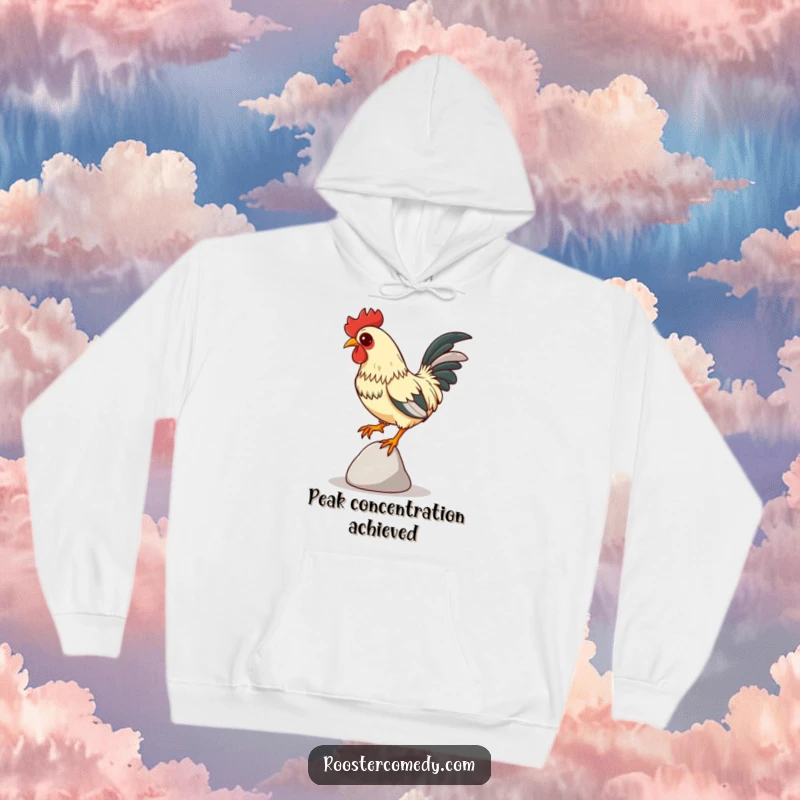Funny Focused Rooster Hoodie, warm sweatshirt with a rooster balancing on a pebble, intense focus, comfortable and funny apparel.