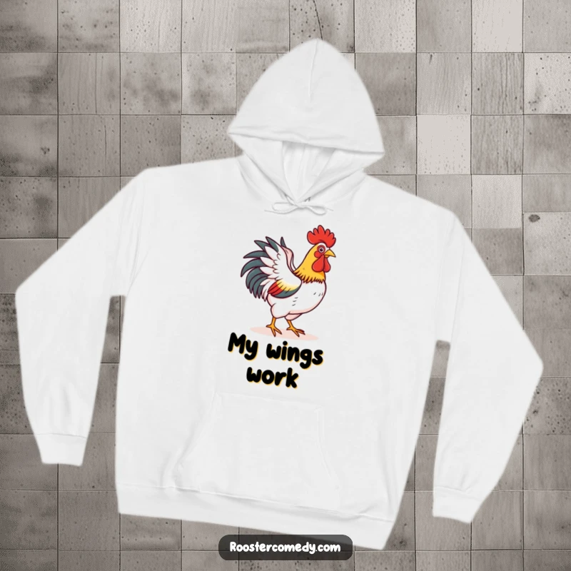 Funny hoodie with a rooster happily flapping its wings as if attempting a short flight, blending warmth with cheerful ambition.