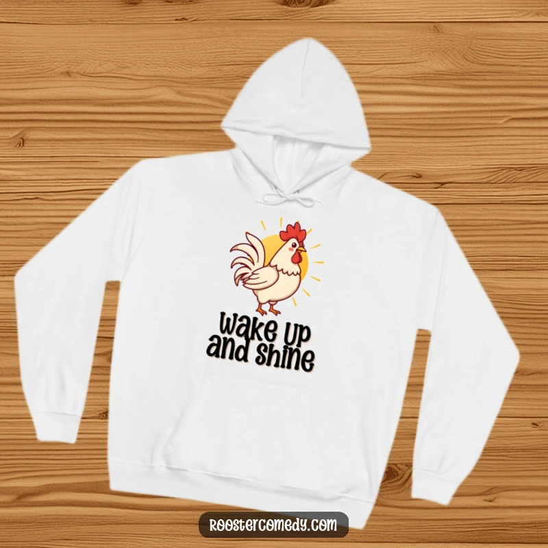 Funny Kawaii rooster crowing at the sunrise, depicted on a warm and cozy hoodie.