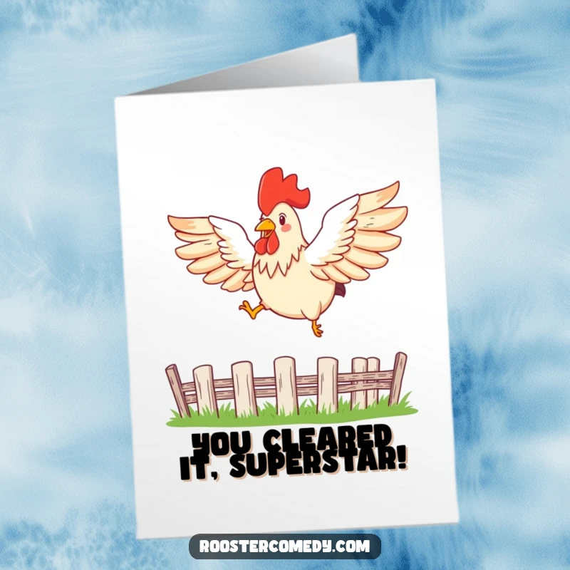 Funny Free Printable Congratulations Card: A rooster with wings spread wide leaps gracefully over a small fence, symbolizing freedom.